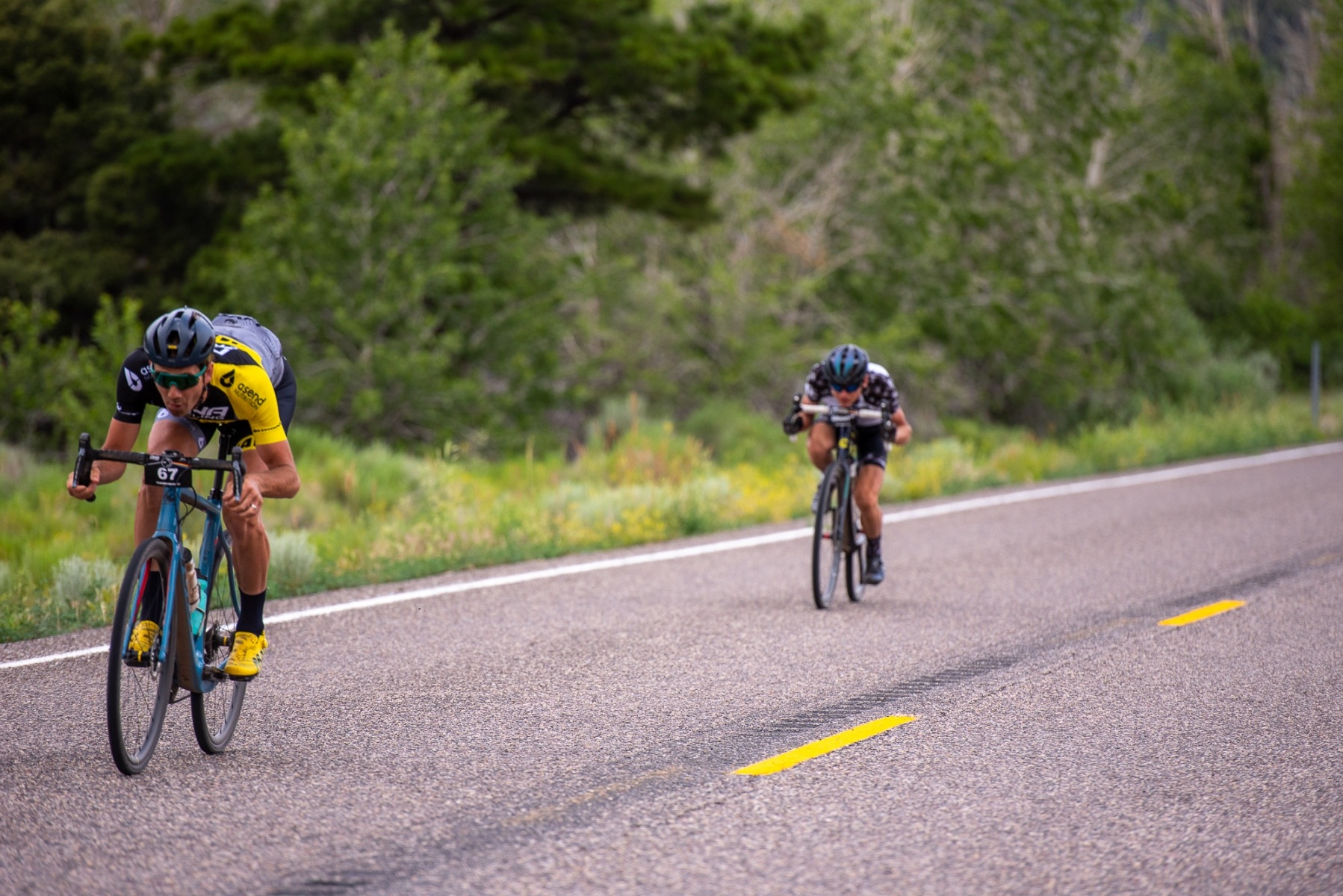 Jamey Driscoll (DNA Cycling-Mavic) leads Alex Grant (Gear Rush) down the Highway 153 descent. Photo: Steven L. Sheffield