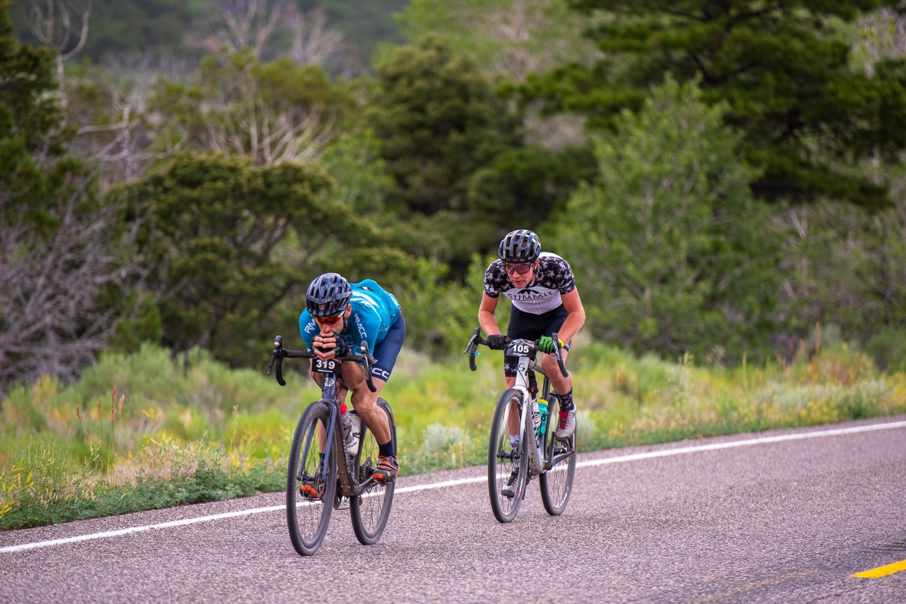 Erik Harrington (#319), leader of the Mens 40-44 group leads Matthew Turner, racing in the Pro/Open field, down the Highway 153 descent. Photo: Steven L. Sheffield.